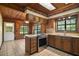 Kitchen view featuring stainless steel appliances, wooden cabinetry, and tile flooring at 17952 Lookout Hill Rd, Winter Garden, FL 34787