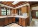 Kitchen showcasing wood cabinets, white countertops, and tile backsplash at 17952 Lookout Hill Rd, Winter Garden, FL 34787