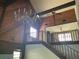 Elegant living room with vaulted wood ceilings, chandelier, and staircase at 17952 Lookout Hill Rd, Winter Garden, FL 34787