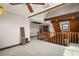 Large living room with beamed ceilings and upper level view at 17952 Lookout Hill Rd, Winter Garden, FL 34787