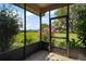 View of a screened-in patio overlooking a landscaped backyard at 17952 Lookout Hill Rd, Winter Garden, FL 34787