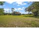 Aerial view of home, with an expansive lawn and mature trees at 17952 Lookout Hill Rd, Winter Garden, FL 34787
