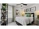 Cozy bedroom with a ceiling fan, neutral decor, and a window at 1916 Diamond Head Cir, Lake Hamilton, FL 33851