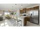 Modern kitchen featuring stainless steel appliances, a large island with seating, and contemporary design at 1916 Diamond Head Cir, Lake Hamilton, FL 33851