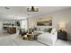 Open living area with stylish furniture, a decorative rug, and an adjacent kitchen at 1916 Diamond Head Cir, Lake Hamilton, FL 33851