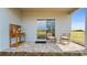 Outdoor patio seating area with sliding glass door, perfect for relaxing and enjoying the backyard view at 1916 Diamond Head Cir, Lake Hamilton, FL 33851