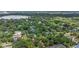 Aerial view of a neighborhood featuring lush greenery and a nearby lake at 1961 Winter Park Rd, Winter Park, FL 32789
