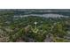 Stunning aerial view of the property, highlighting its lush surroundings, and proximity to a lake at 1961 Winter Park Rd, Winter Park, FL 32789