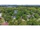 Aerial view of a neighborhood featuring lush trees and diverse homes at 1961 Winter Park Rd, Winter Park, FL 32789
