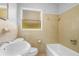 Full bathroom featuring vintage-style sink and toilet, with tiled walls at 1961 Winter Park Rd, Winter Park, FL 32789