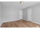 Bedroom with wood-look laminate flooring and neutral gray walls at 1961 Winter Park Rd, Winter Park, FL 32789
