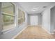 Bonus room with tile floors, three windows, and large closet for extra storage at 1961 Winter Park Rd, Winter Park, FL 32789