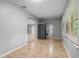 Open kitchen with tan tile flooring, white-washed ceilings, and stainless steel refrigerator at 1961 Winter Park Rd, Winter Park, FL 32789