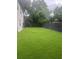 Picture of a big backyard with a lush green lawn and privacy fence at 2011 E Esther St, Orlando, FL 32806