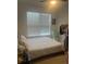 Bedroom featuring a window with blinds, ceiling fan, and neutral colored walls at 2011 E Esther St, Orlando, FL 32806