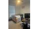 Bedroom featuring a window with blinds, ceiling fan, and carpet flooring at 2011 E Esther St, Orlando, FL 32806