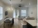 Bright living area with dining table, comfortable seating, and ample natural light at 2011 E Esther St, Orlando, FL 32806
