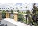 Enjoy the views from this tiled balcony with decorative iron railings and stately columns at 2404 Bella Vista Dr, Davenport, FL 33897