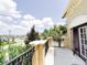 Balcony boasts lush greenery, providing an inviting space to relax and enjoy the scenic neighborhood views at 2404 Bella Vista Dr, Davenport, FL 33897