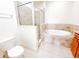 Elegant bathroom featuring a large soaking tub, tiled shower with glass door, and vanity with granite countertop at 2404 Bella Vista Dr, Davenport, FL 33897