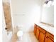 Bathroom with vanity, ceramic tile floor, shower-tub combo, and white toilet for a simple, clean design at 2404 Bella Vista Dr, Davenport, FL 33897