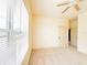 Inviting bedroom features a large window with blinds, neutral carpet, and ample natural light for comfort at 2404 Bella Vista Dr, Davenport, FL 33897