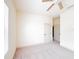 Bright bedroom with neutral carpet, ceiling fan, and natural light, offering a serene and inviting space at 2404 Bella Vista Dr, Davenport, FL 33897