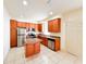 Modern kitchen with stainless appliances, granite countertops, and tile floors at 2404 Bella Vista Dr, Davenport, FL 33897