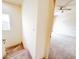 Carpeted staircase with white walls, transitioning to a carpeted hallway with open doorway to bedroom at 2404 Bella Vista Dr, Davenport, FL 33897