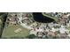 Aerial view of the house in a community near a pond and playground at 2543 Chapala Dr, Kissimmee, FL 34746