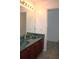 Bathroom boasts double sink vanity with marble countertops and tiled floors at 2543 Chapala Dr, Kissimmee, FL 34746
