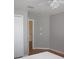 Bedroom featuring wood-look floors, closet and a view to a hallway at 2543 Chapala Dr, Kissimmee, FL 34746