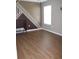 Empty bedroom with a geometric accent wall and wood-look floors at 2543 Chapala Dr, Kissimmee, FL 34746