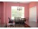 Cozy dining area with large window for natural light, adjacent to the kitchen at 2543 Chapala Dr, Kissimmee, FL 34746