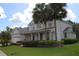 Attractive two-story home boasting well-manicured landscaping, a covered entry, and a neatly maintained lawn at 2543 Chapala Dr, Kissimmee, FL 34746