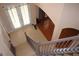 View of the foyer features tile flooring and a staircase leading to the upper level at 2543 Chapala Dr, Kissimmee, FL 34746