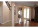 Spacious foyer showcasing hardwood floors and natural light streaming through the front doors at 2543 Chapala Dr, Kissimmee, FL 34746