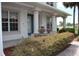 Covered front porch features columns, fountain and well maintained shrubbery at 2543 Chapala Dr, Kissimmee, FL 34746