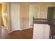 Hallway featuring wood flooring, two closets, and doorway access at 2543 Chapala Dr, Kissimmee, FL 34746