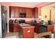 Well-appointed kitchen with granite countertops, dark wood cabinetry and modern appliances at 2543 Chapala Dr, Kissimmee, FL 34746
