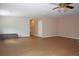 Living room with hardwood flooring, a ceiling fan, arch doorway, and a cozy bench at 2543 Chapala Dr, Kissimmee, FL 34746