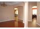 Spacious living room showcasing an open layout, archways, and gleaming wood floors at 2543 Chapala Dr, Kissimmee, FL 34746