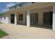 Wide, covered patio of home with sliding glass doors, offering relaxation and outdoor living at 2543 Chapala Dr, Kissimmee, FL 34746