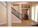 Elegant staircase with wood railings, tile flooring, and transom windows at 2543 Chapala Dr, Kissimmee, FL 34746