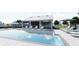Community pool with lounge chairs and umbrellas perfect for relaxing and enjoying the outdoors at 2547 Long Pine Ave, Apopka, FL 32712