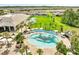 Resort-style pool with a covered seating area and palm trees providing a relaxing atmosphere at 2578 Cliff Way, St Cloud, FL 34771