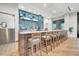 Modern bar area with light wood accents, stylish seating, and beverage taps at 2578 Cliff Way, St Cloud, FL 34771