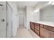 Bathroom with dual vanity, spacious shower, and tile flooring at 2578 Cliff Way, St Cloud, FL 34771