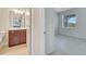 Bathroom featuring double sinks, and neutral gray paint, and carpet in the bedroom at 2578 Cliff Way, St Cloud, FL 34771