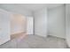 Clean, carpeted bedroom with a view of an open doorway, white walls, and recessed lighting fixtures at 2578 Cliff Way, St Cloud, FL 34771
